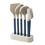 Set of five kitchen utensils with blue handles on a white stand 