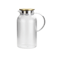 Clear glass pitcher with ribbed design and gold lid 
