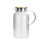 Clear glass pitcher with ribbed design and gold lid 