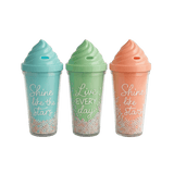 Three colorful plastic cups with ice cream shaped  lid. The cups have text and decorative beads