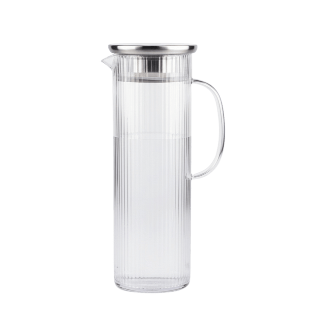 Long clear glass pitcher with a silver lid 