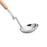A close up of the Serving stainless steel ladle with a wooden handle 
